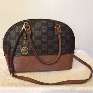 Brown Anne Klein hand bag with cross body strap.